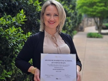 jenni swain with certificate